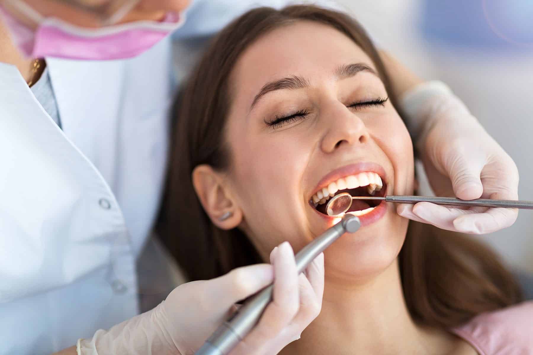 Woman getting dental restorations in Grand Bay, AL