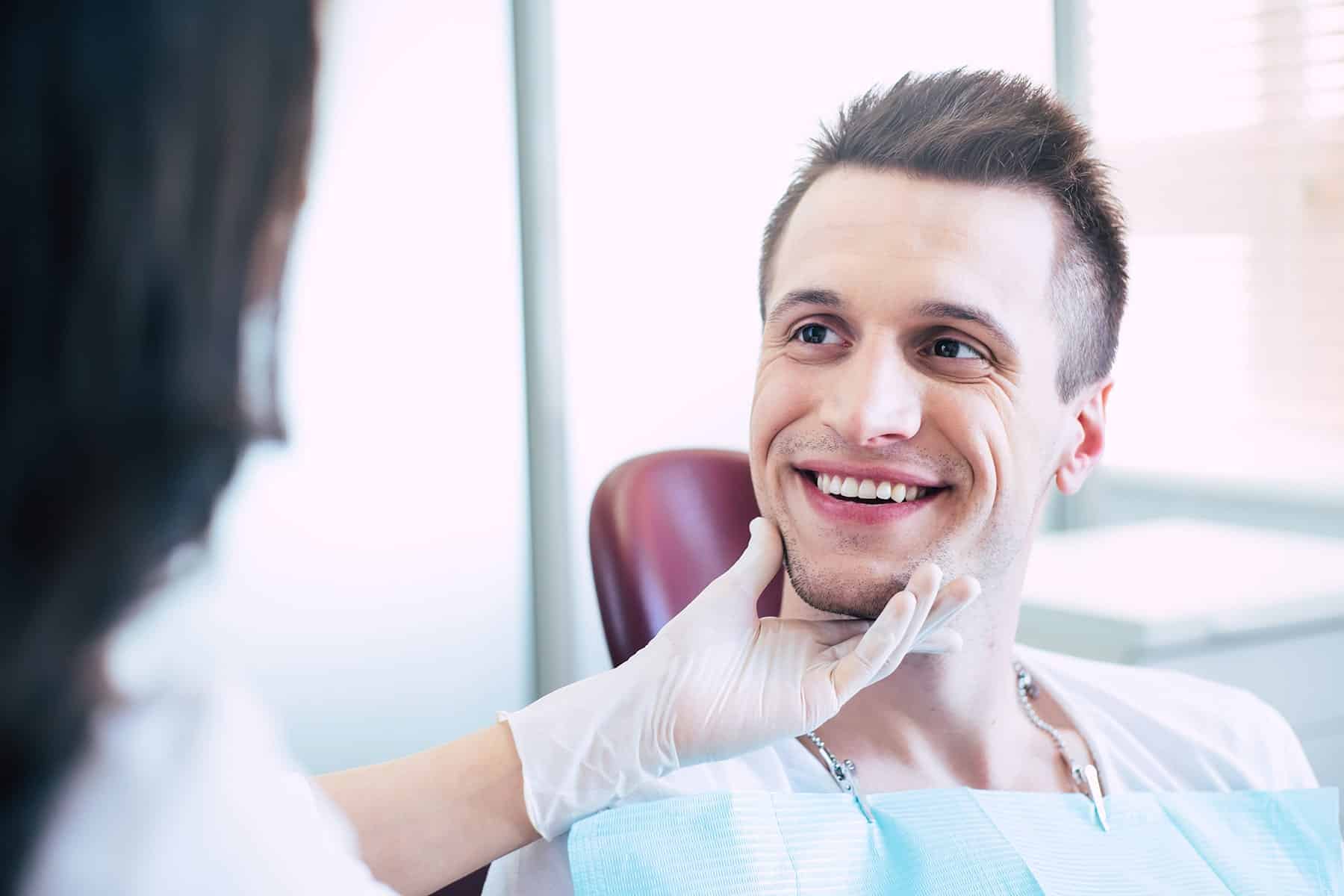 Man smiling with TeethXpress dental implants in Grand Bay, AL