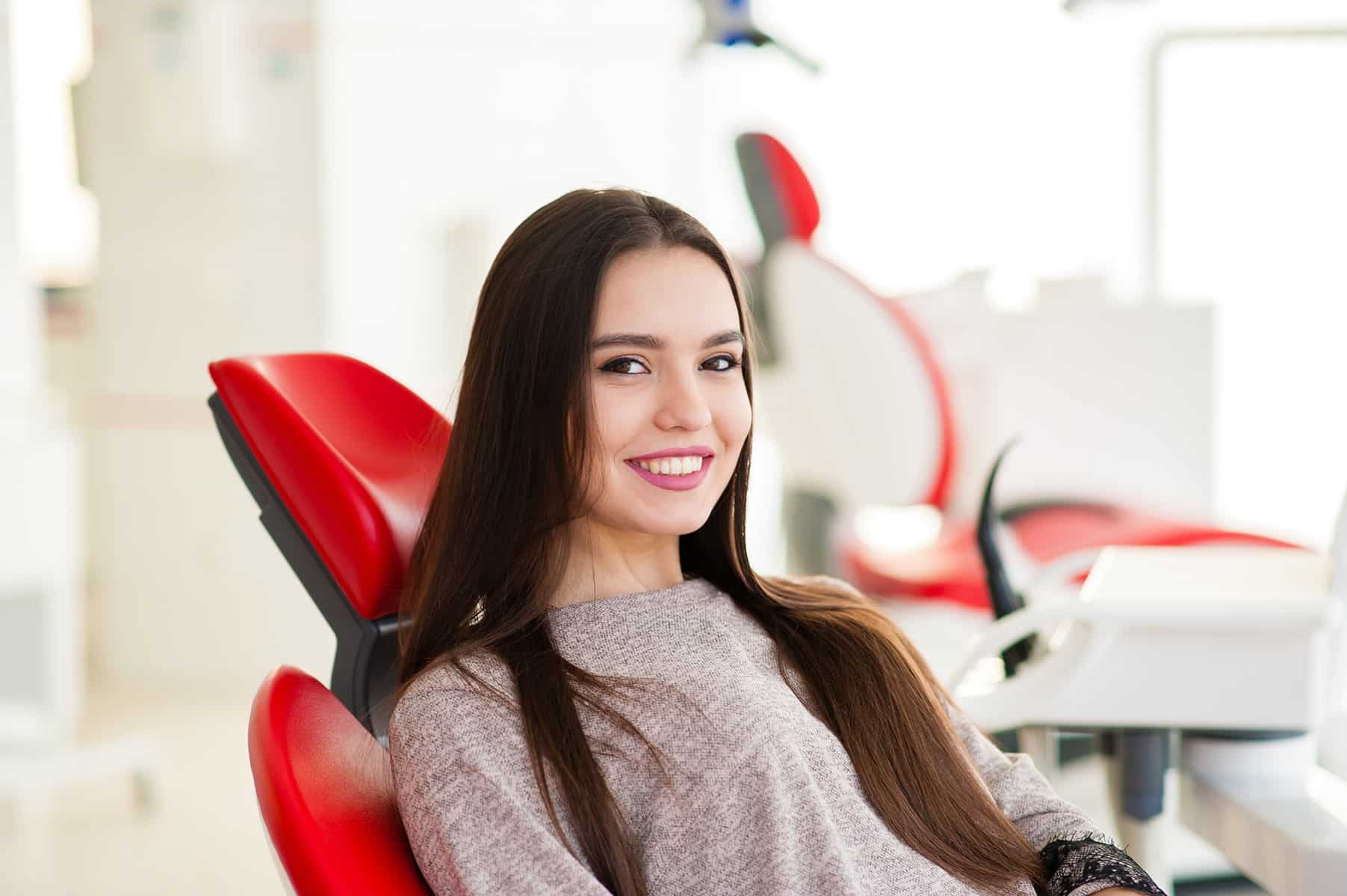 Woman smiling at a TeethXpress appointment in Grand Bay, AL